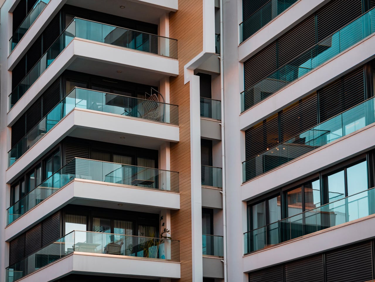 gallery-01 Contemporary architecture showcasing glass balconies and sleek design.